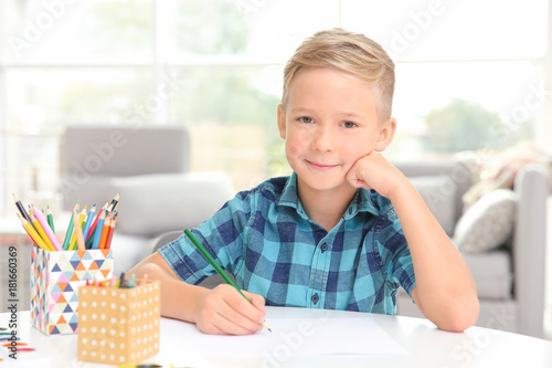 Cute little boy drawing at ...