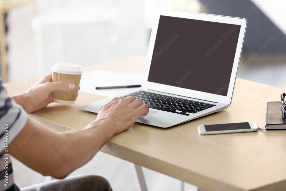 Man using laptop indoors Man using laptop indoors