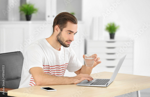 Attractive man with laptop ...