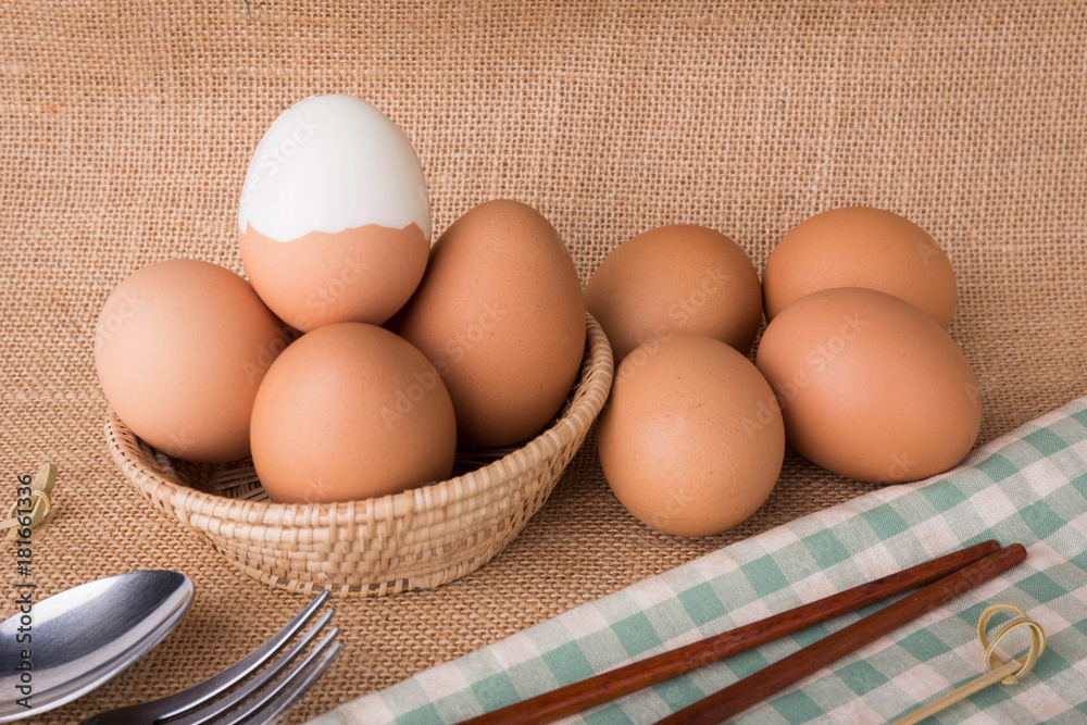 Set Eggs in a basket on gunny (sackcloth) background Set Eggs in a basket on gunny (sackcloth) background