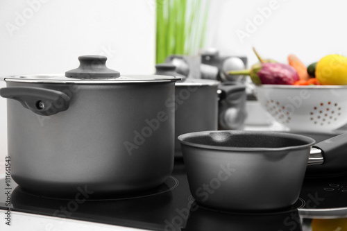 Cooking utensils on electric stove in kitchen