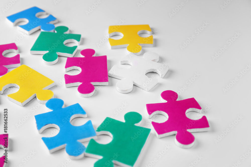 Puzzle pieces on white background as symbol of autism Puzzle pieces on white background as symbol of autism