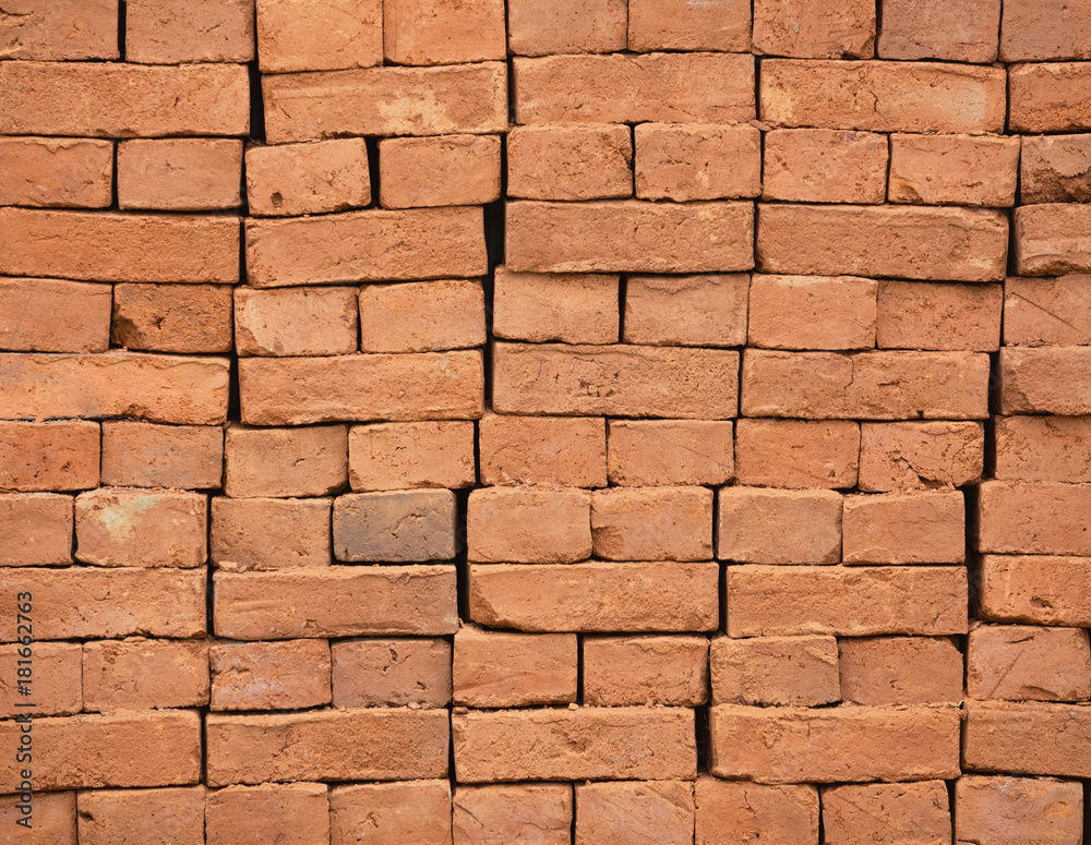Obraz premium Stack of new red bricks background