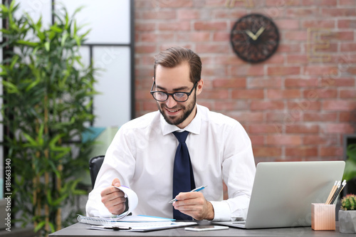 Young man working in office