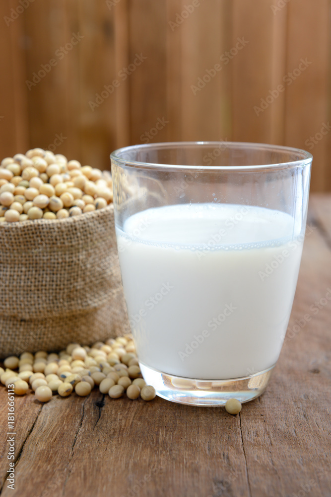 Soy milk and soy bean on wooden background Soy milk and soy bean on wooden background