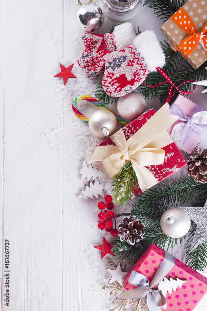 Christmas background with gift boxs, christmas tree, mittens and decorations Christmas background with gift boxs, christmas tree, mittens and decorations