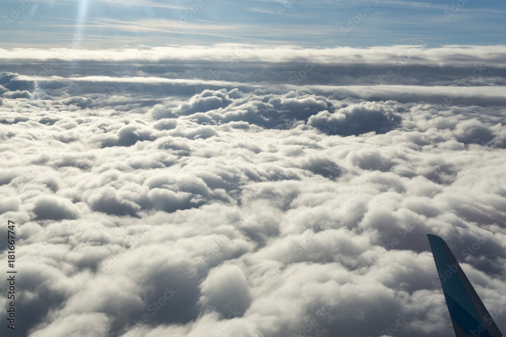 Fototapeta premium Over the clouds. Photo from plane.