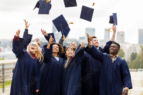 Photography happy graduates or students throwing mortar boards