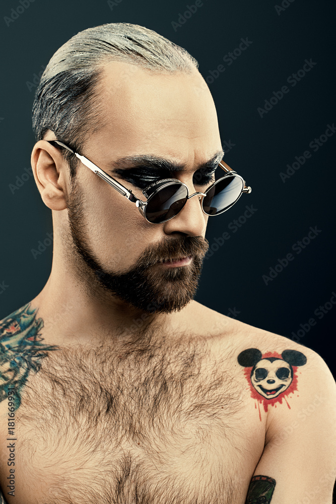Portrait of Man with beard in glasses and art makeup on dark background. Man  with tattoo Stock Photo | Adobe Stock