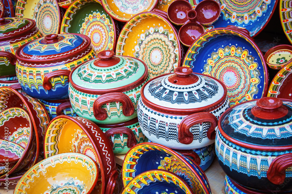Colorful ceramic dishes. Traditional bugarian patterns. - obrazy, fototapety, plakaty 