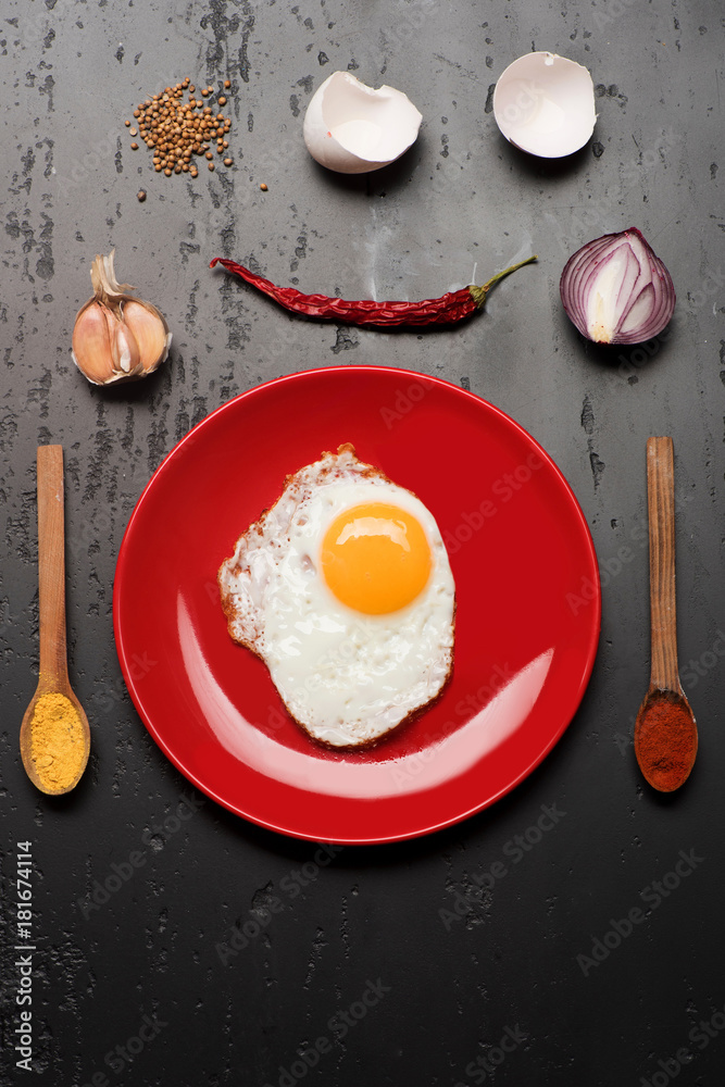 Omelet and eggshells, garlic, chili pepper and onion placed around Omelet and eggshells, garlic, chili pepper and onion placed around