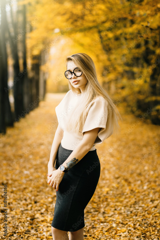 Portrait pretty smiling young woman in sunny autumn day Portrait pretty smiling young woman in sunny autumn day
