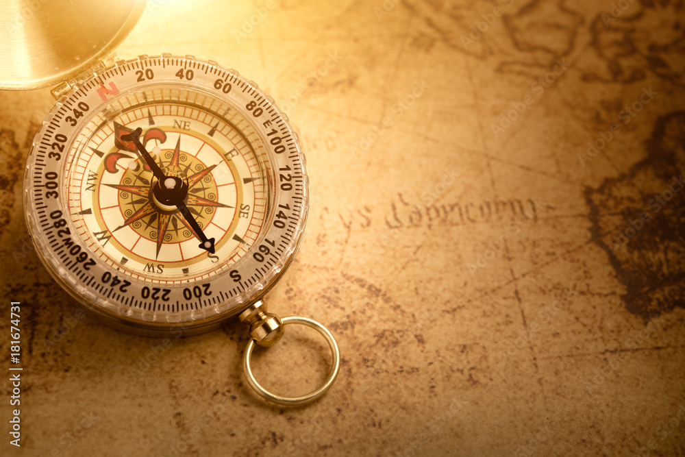 Old vintage compass with vintage map