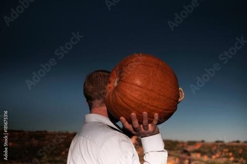 The man carrying a pimpkin photo