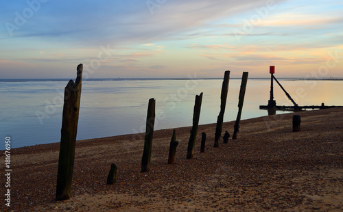 old Breakwater on seafront  at twilpght Suffolk 