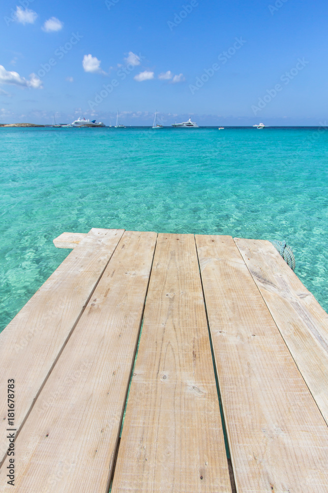 Sea wooden pier and transparent water