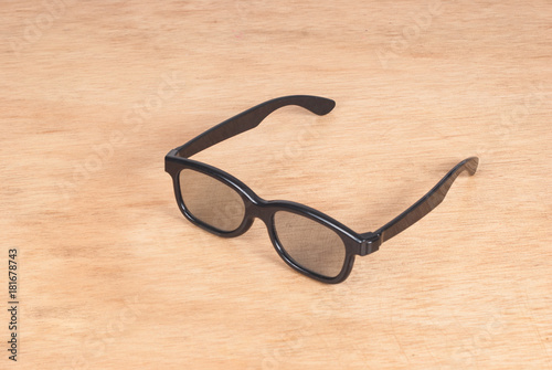 black glasses on the wooden background