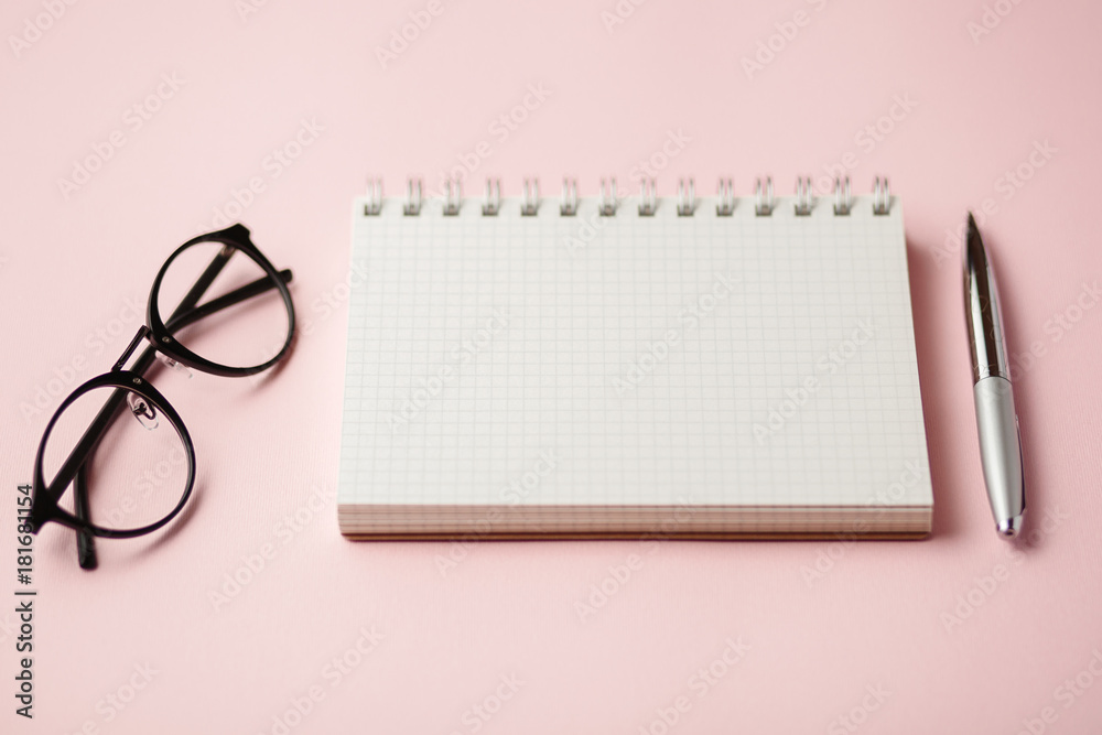 school notebook on a pink background