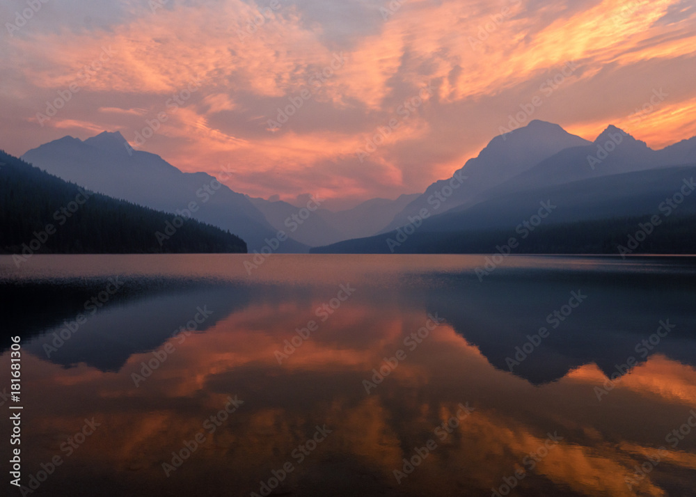 Dramatic summer sunrise over a mountain lake
