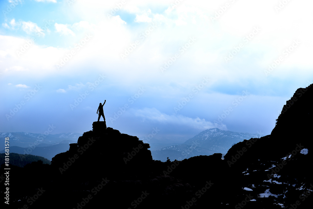 lonely and successful climber in magnificent mountains lonely and successful climber in magnificent mountains