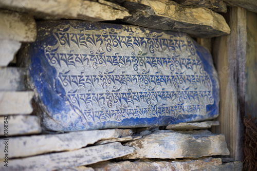 Stone with tibetian mantras Tibet sanscrit photo