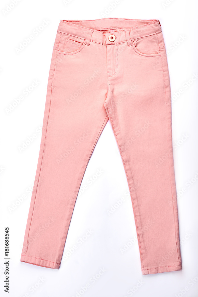 Teen girls beautiful summer trousers. Peach color denim pants for girls,  isolated on white background. Girls modern outfit. Stock Photo