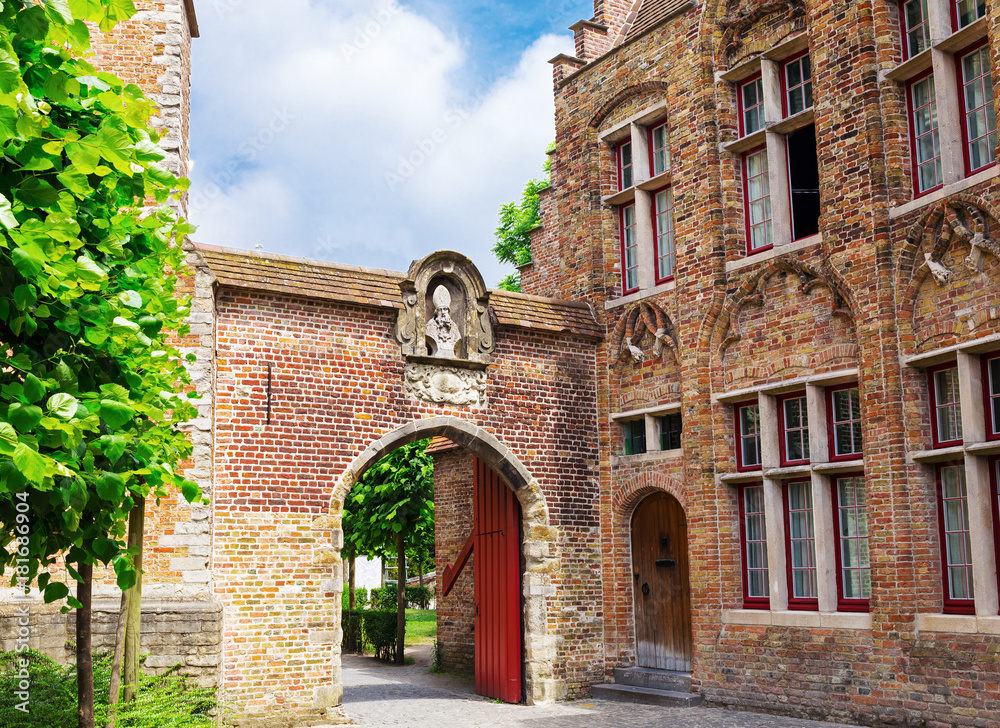 A typical old gate in the streets of Bruges,  Belgium