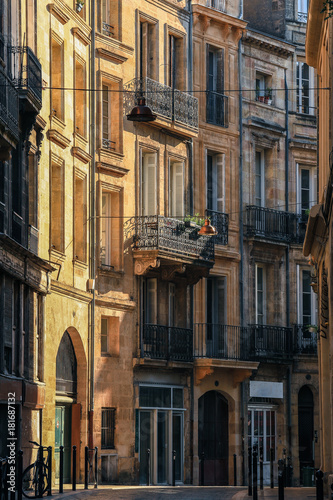 Front view of residential buildings architecture in Bordeaux with morning light, vintage style 