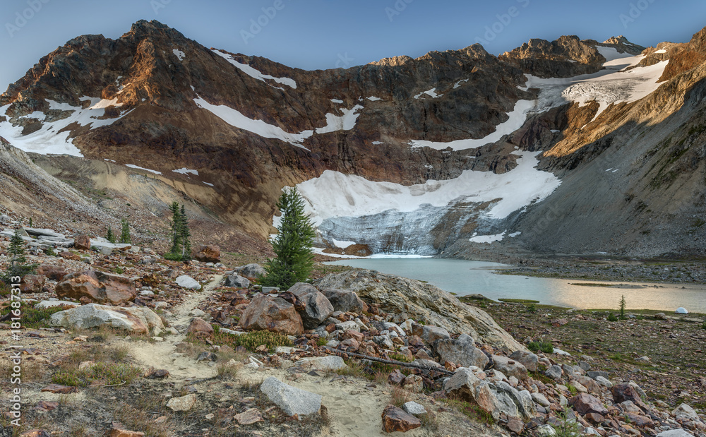 Glacier Recedes into Beautiful Alpine Lake at Dawn