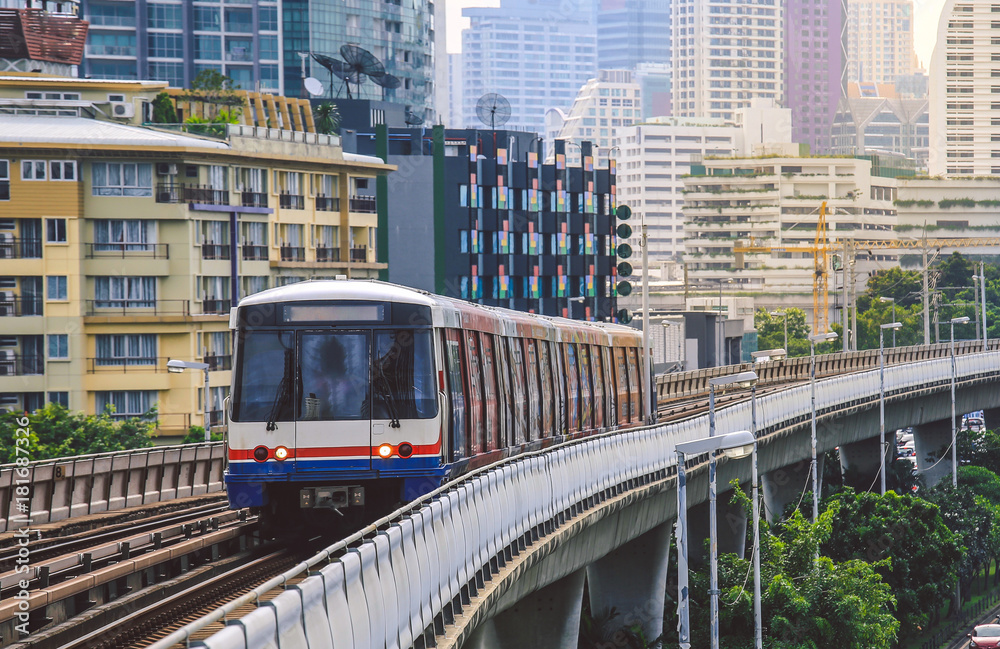 Naklejka premium BTS Sky Train is running in downtown of Bangkok. Sky train is fastest transport mode in Bangkok