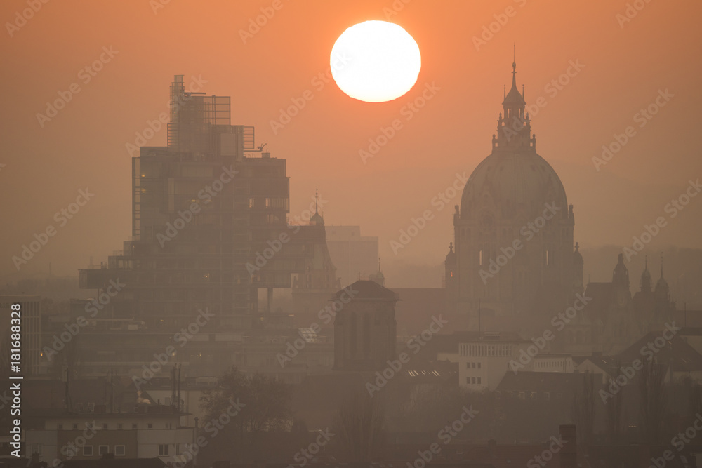 Silhouette of Hanover in summer evening fog at sunset. Lower Saxony.
