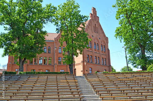 View of the building of district court through ranks of an amphitheater. Braniewo, Poland photo