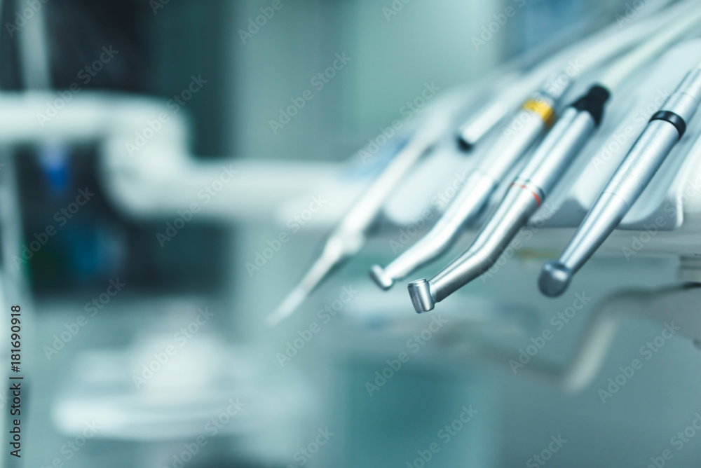 Dental instruments on the dental chair, closup photo Dental instruments on the dental chair, closup photo