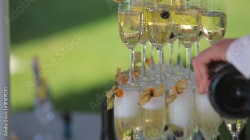 Glasses with wine or champagne on the table. Champagne slide photo