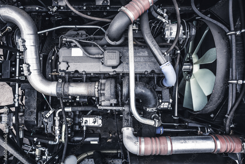 Top view of new modern diesel agricultural  tractor or combine or car motor or harvester engine, toned