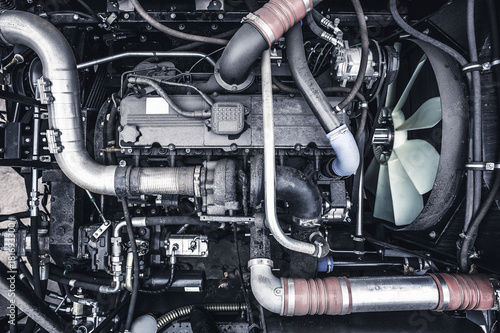 Top view of new modern diesel agricultural  tractor or combine or car motor or harvester engine, toned