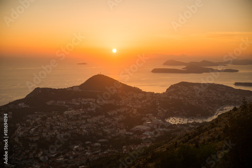 Sunset on the Adriatic sea with layers mountains on the horizon. Beautiful panoramic view of Dubrovnik  Croatia.