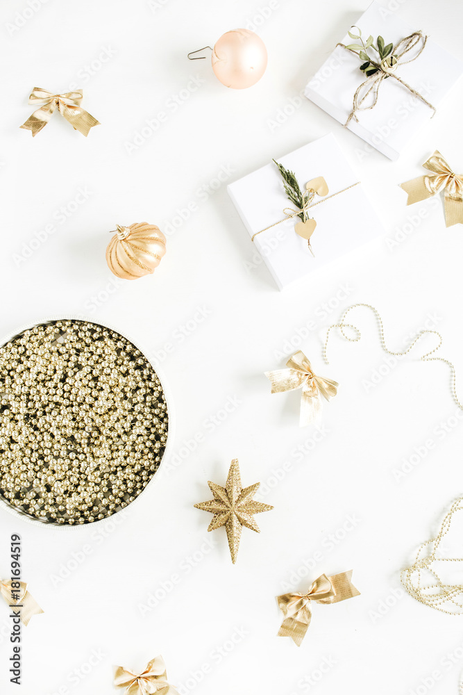 Christmas gifts and baubles on white background. Flat lay, top view New Year composition. Christmas gifts and baubles on white background. Flat lay, top view New Year composition.