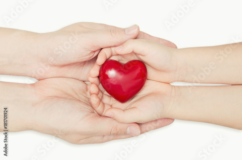 Parent and child holding heart in hand