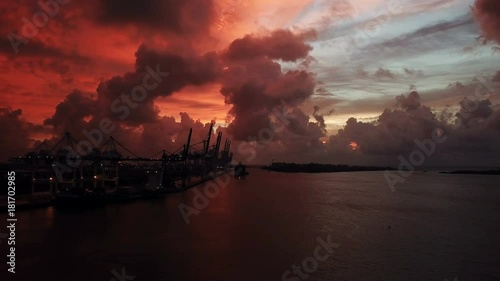 An Amazing Sunrise Where The Sky Turned Red. Over Looking Miami Loading Cranes With Stacks Of Containers and NO! The Red Sky Is Not Manipulated To Look Like This. End Of The World