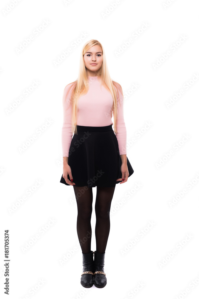 Attractive young fashion model wearing dress in studio and smiling Attractive young fashion model wearing dress in studio and smiling