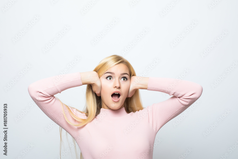 picture of woman with hands on ears on white background picture of woman with hands on ears on white background