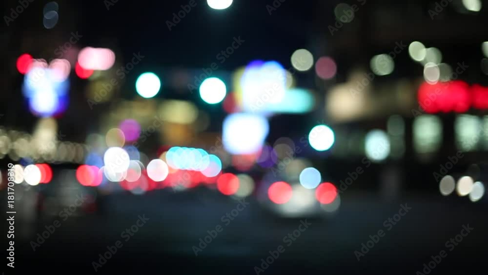 Driving through the city at night in traffic, lights with blur effect