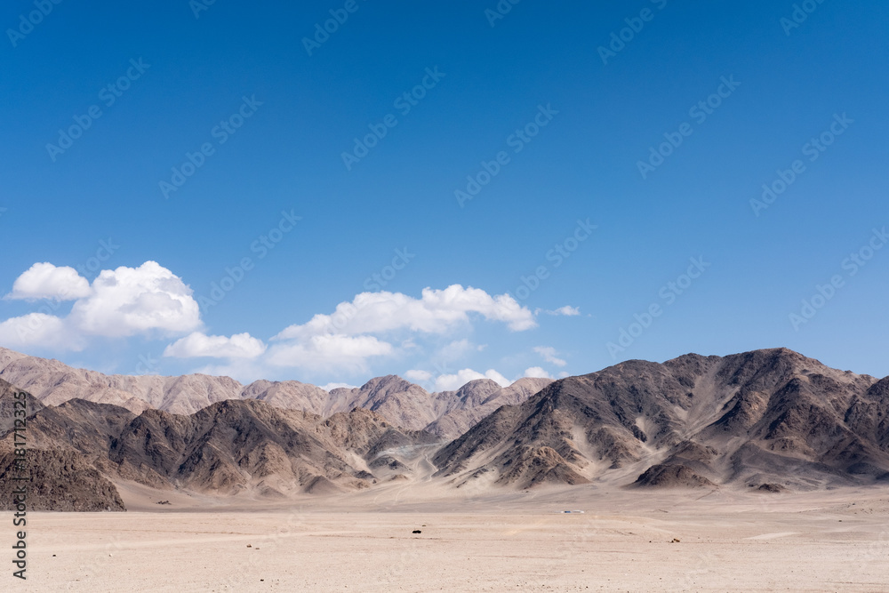 Landscape image of mountains and blue sky background in Ladakh , India Landscape image of mountains and blue sky background in Ladakh , India