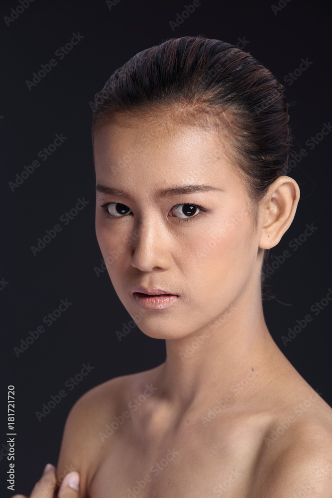 Asian Black wrapped Hair Clean Look Young Woman open shoulders Asian Black wrapped Hair Clean Look Young Woman open shoulders