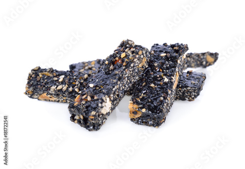 pile of sweetened black sesame stick on white background