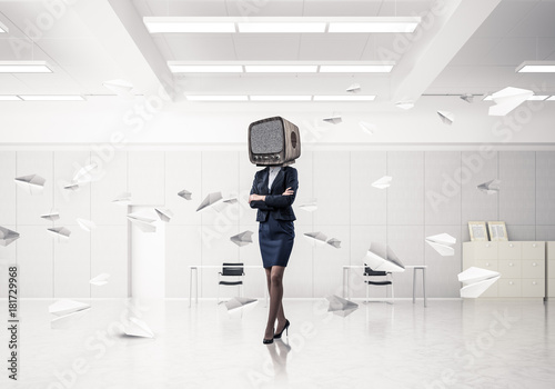 Business woman with an old TV instead of head.