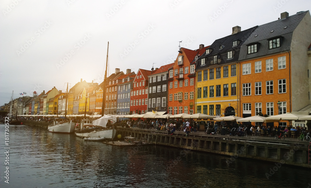 Nyhavn in Copenhagen - boats and colorful facades of the houses