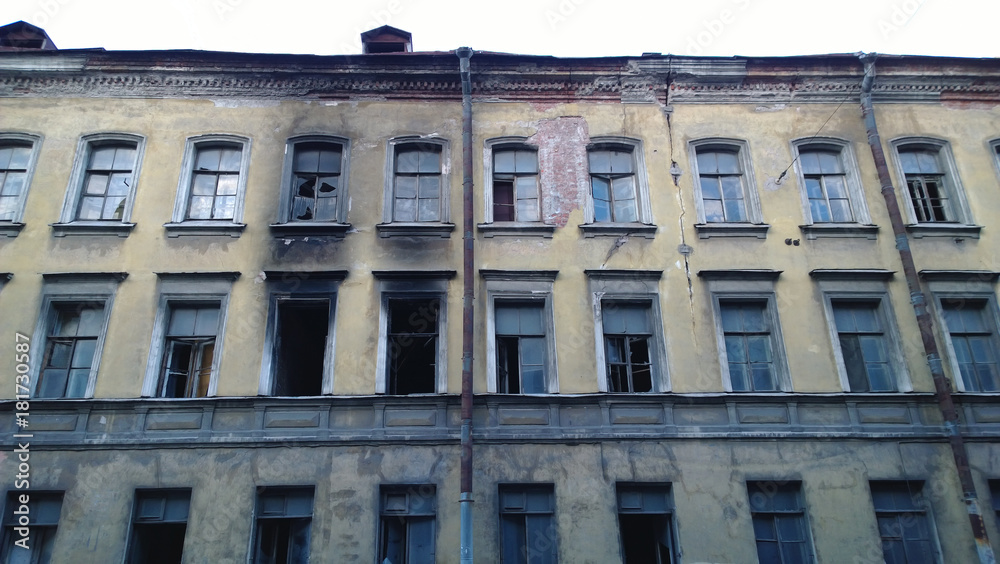 An old abandoned building and traces of fire - soot on the walls near the windows An old abandoned building and traces of fire - soot on the walls near the windows