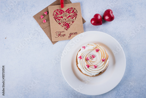 Lemon Tart with meringue and cup of coffee, milk with holiday decorations for Valentines day. Sweet Сandies in form of heart. Red paper note message card For You